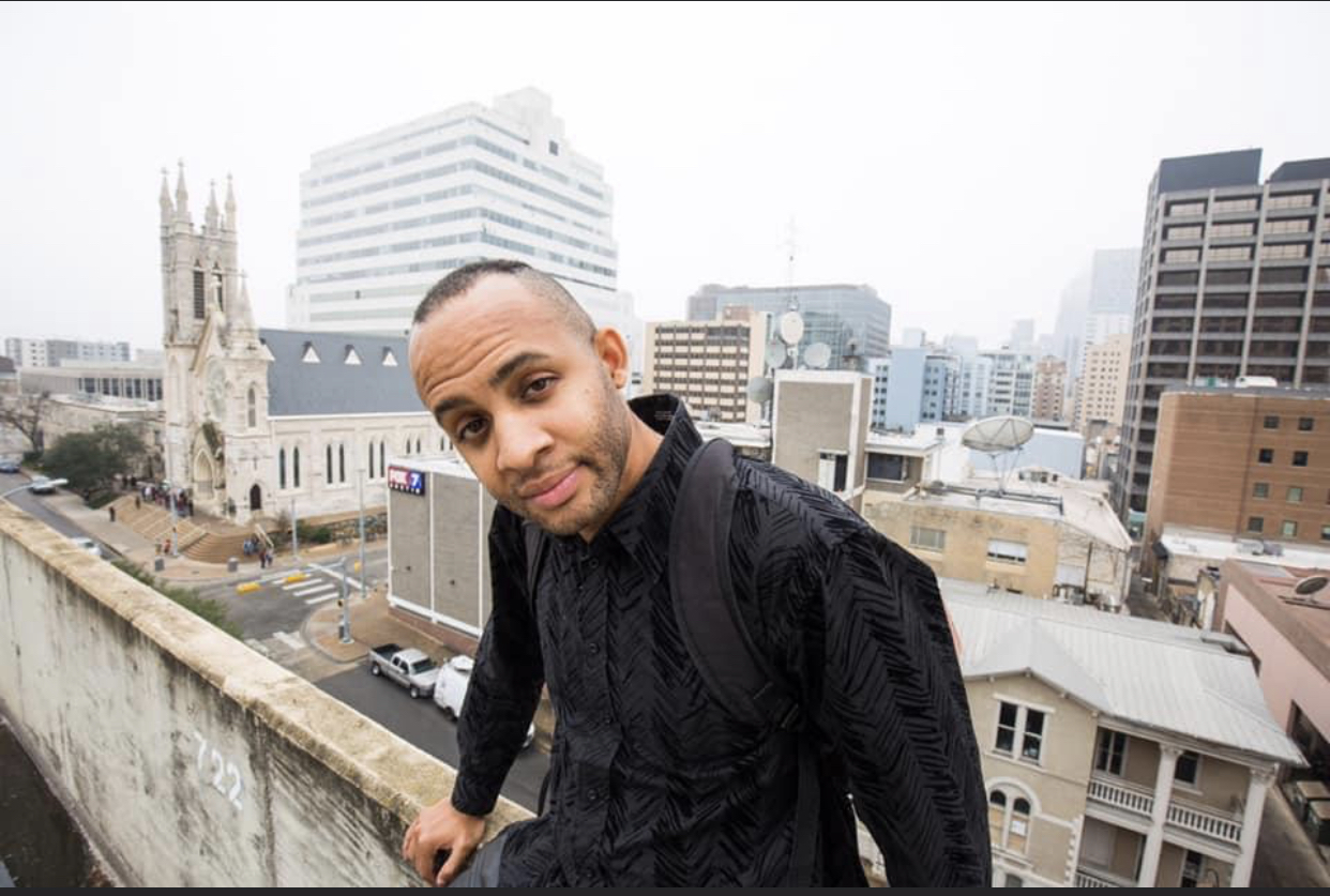 Cauvee on top of a building looking into your eyes